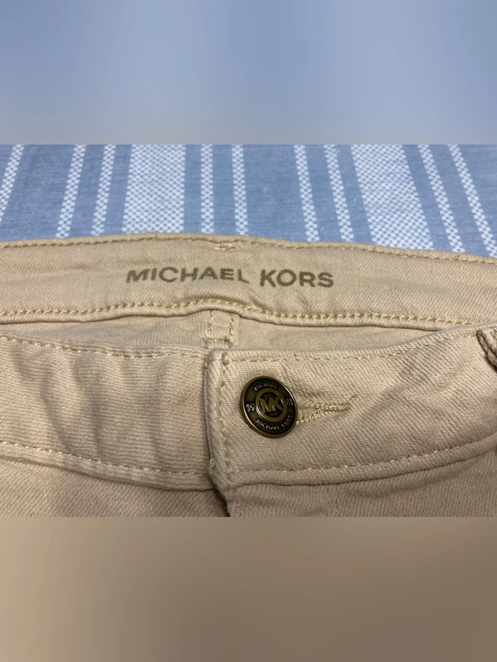 Michael Kors tan Bermuda shorts.